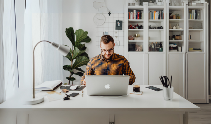 a man working on laptop in image